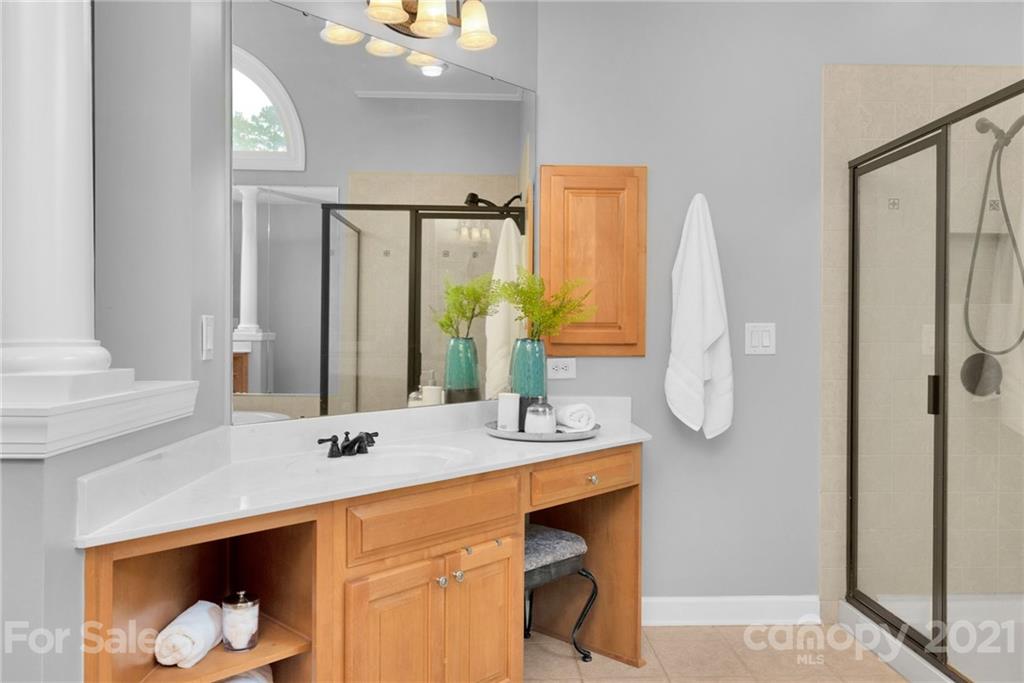 1111 Lytton Lane Matthews, NC 28104 - Photo 26 of 48 a bathroom with a sink vanity and a mirror