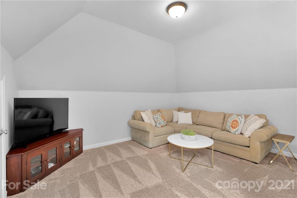 1111 Lytton Lane Matthews, NC 28104 - Photo 39 of 48 a living room with furniture and a flat screen tv
