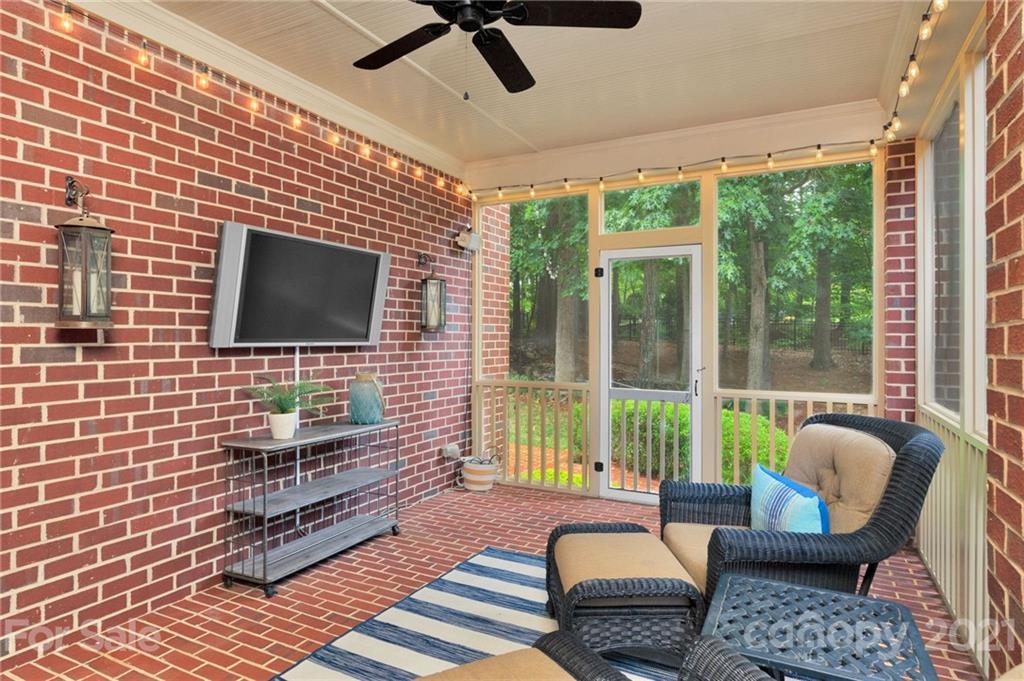 1111 Lytton Lane Matthews, NC 28104 - Photo 9 of 48 a living room with patio furniture and a flat screen tv