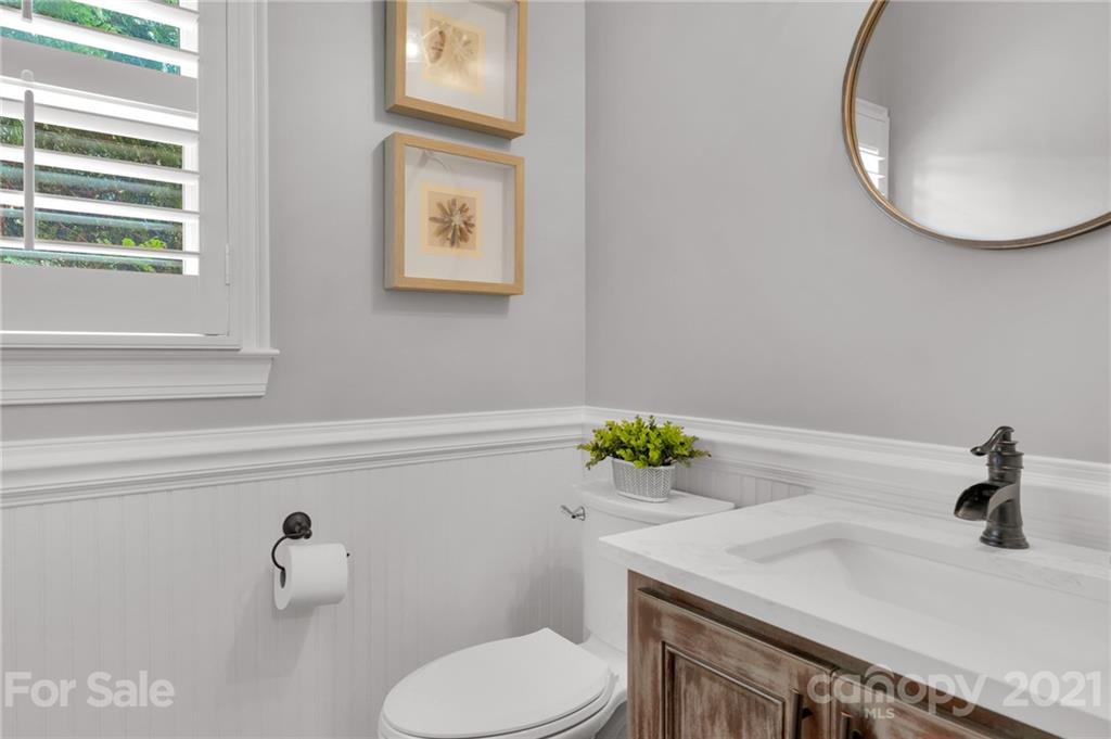 1111 Lytton Lane Matthews, NC 28104 - Photo 10 of 48 a bathroom with a sink toilet and a mirror