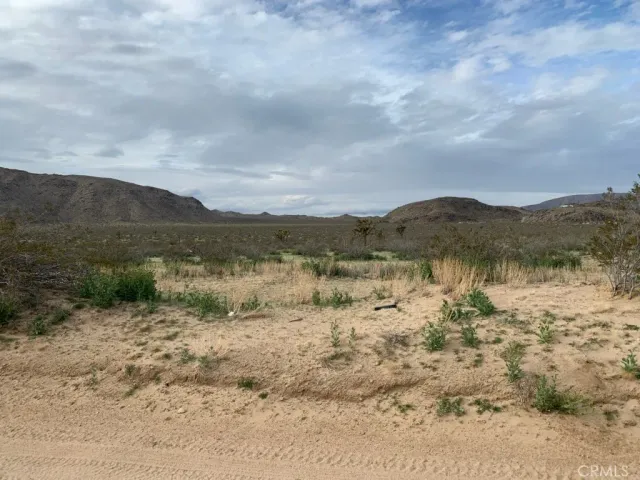 a view of a lake with mountains in the background