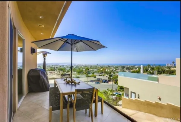 a view of a balcony with chairs