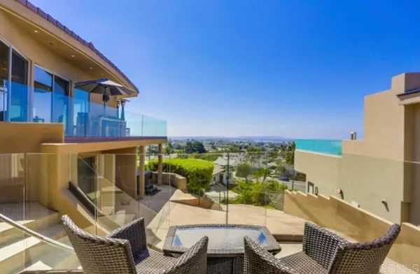 a view of a chairs and table in the patio