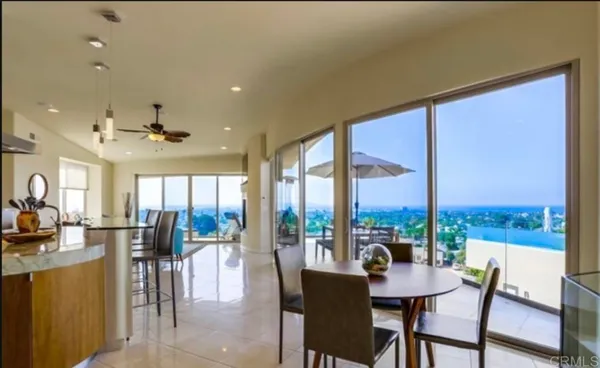a view of a dining room with furniture window and outside view