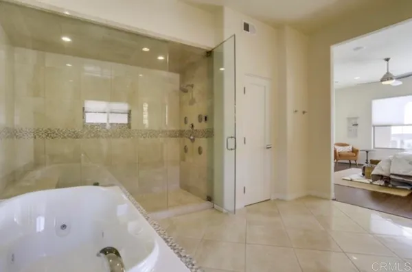 a bathroom with a tub and a shower