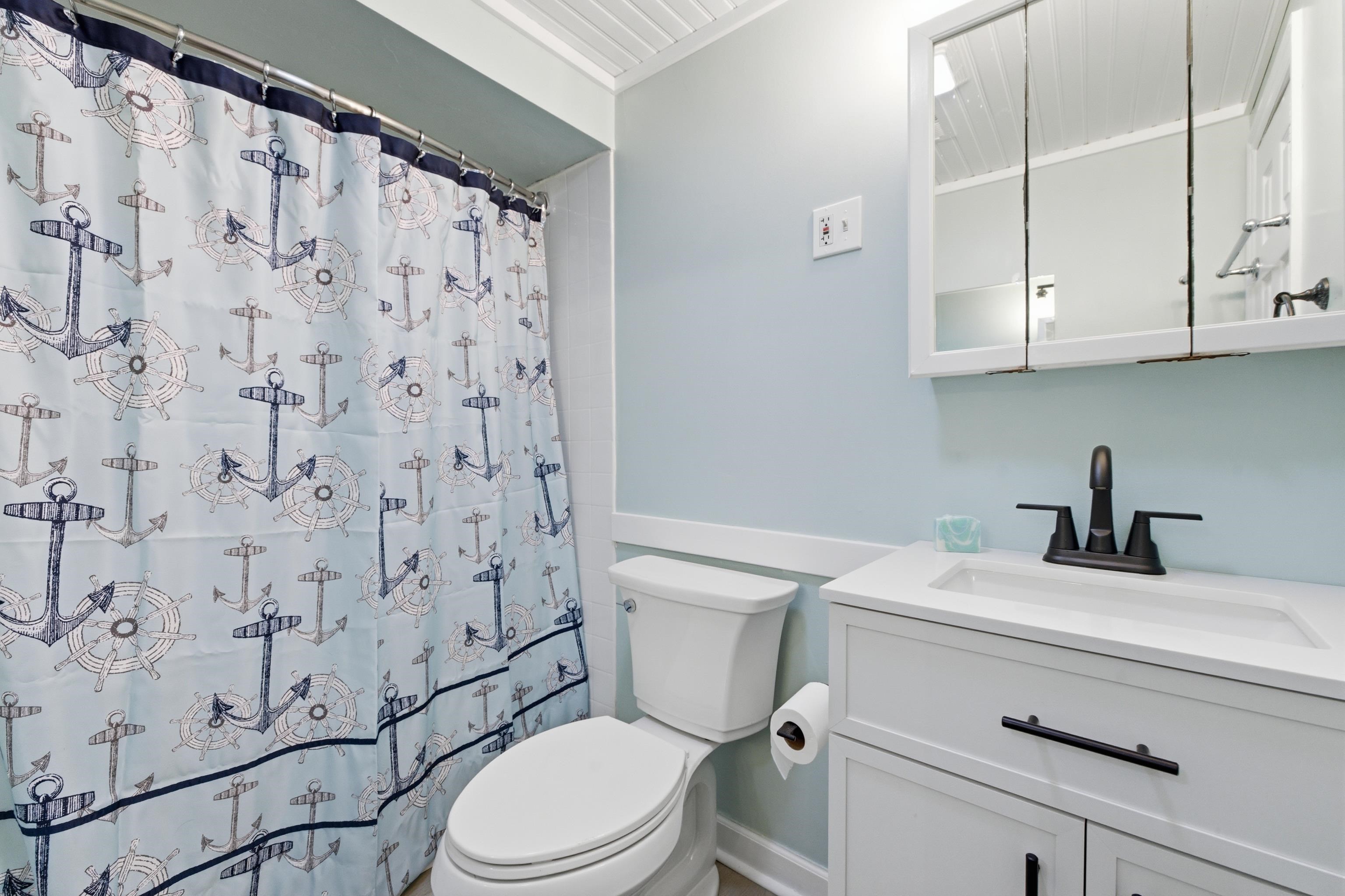 16 East Drumbed Road Villas, NJ 08251 - Photo 27 of 28 a bathroom with a sink a toilet and shower curtain