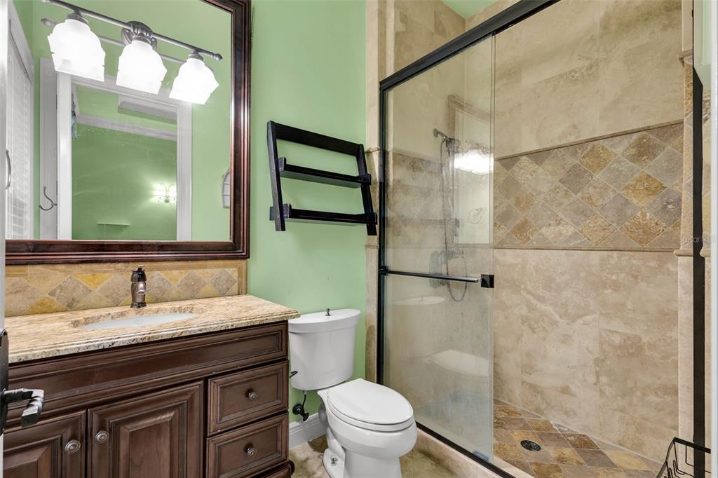 5417 Osprey Isle Lane Windermere, FL 34786 - Photo 15 of 45 a bathroom with a sink toilet and shower