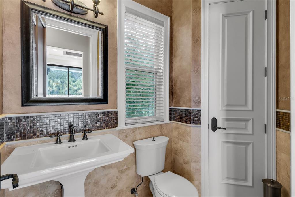 5417 Osprey Isle Lane Windermere, FL 34786 - Photo 17 of 45 a bathroom with a sink a toilet and tub