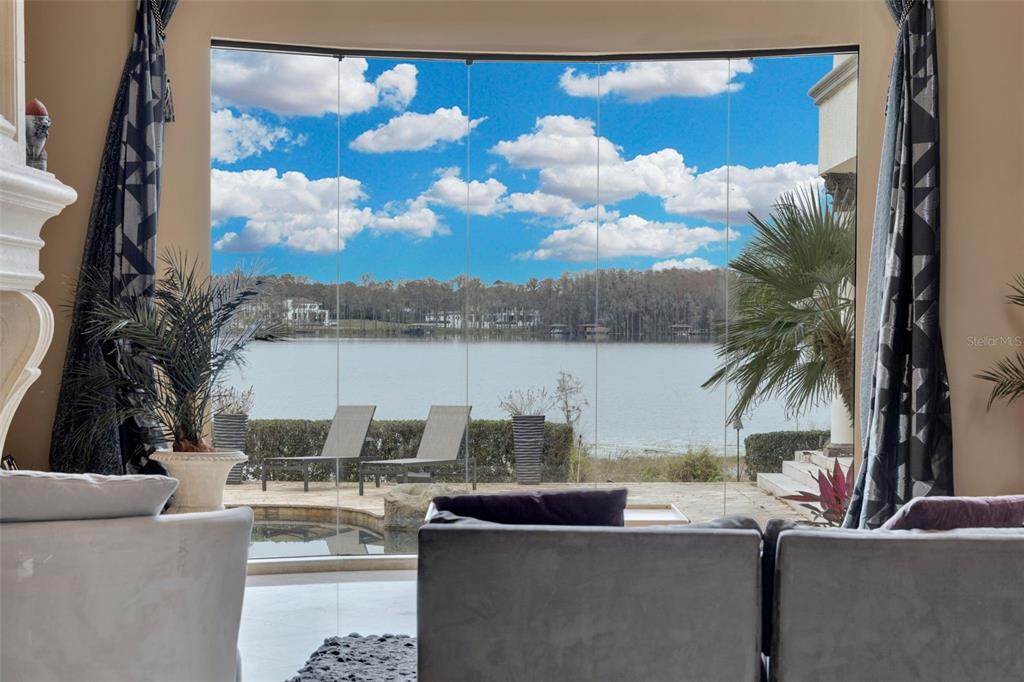 5417 Osprey Isle Lane Windermere, FL 34786 - Photo 40 of 45 a view of kitchen with kitchen island and living room