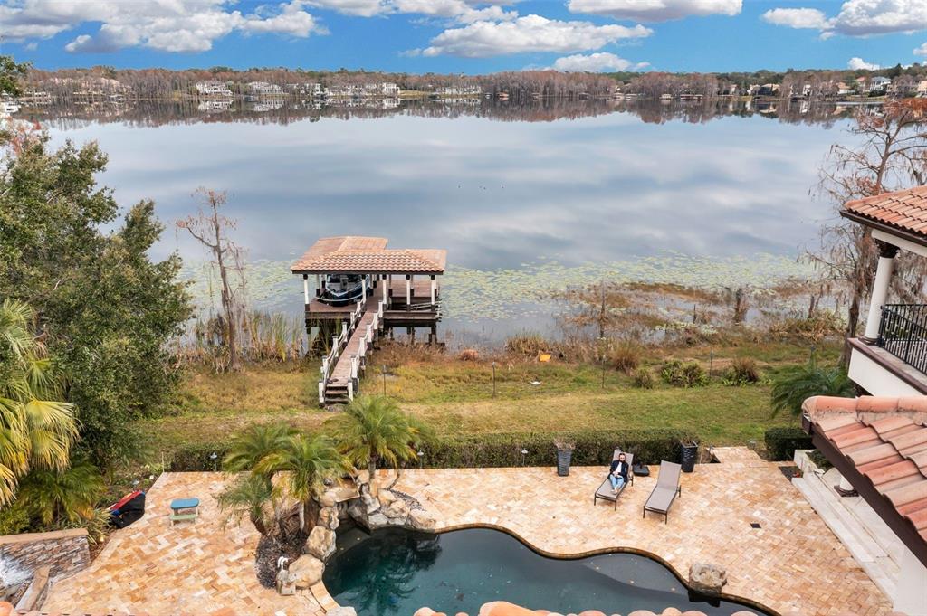 5417 Osprey Isle Lane Windermere, FL 34786 - Photo 45 of 45 a view of a lake in middle of the town