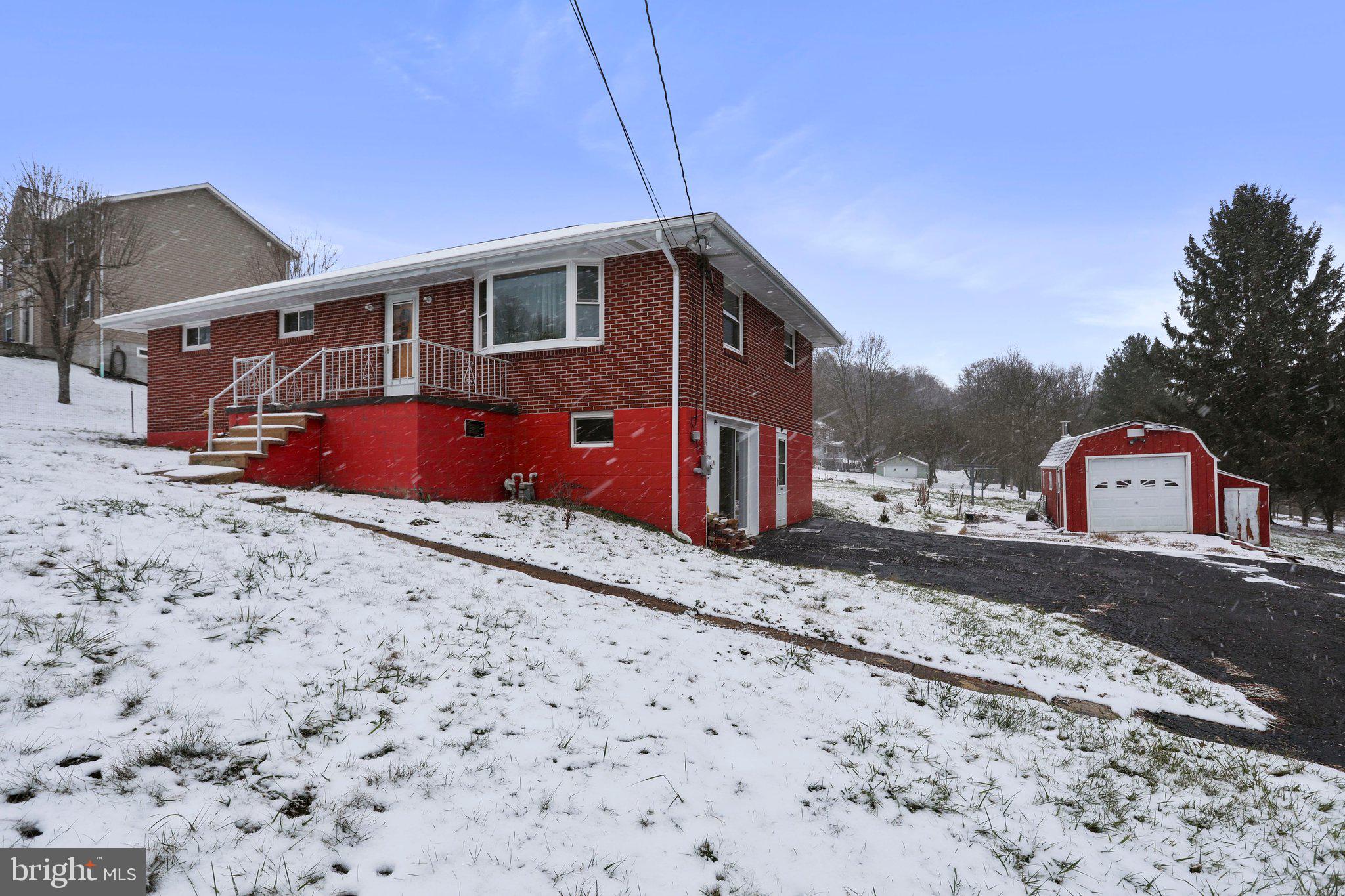 View of the driveway and storage shed!