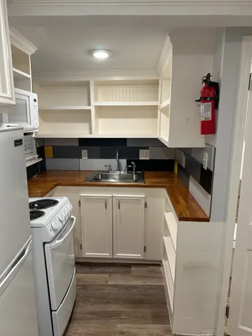 a kitchen with a sink and cabinets