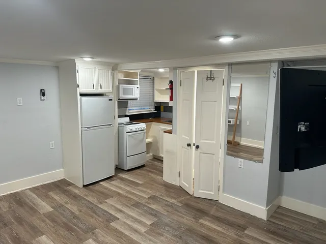 a kitchen with a refrigerator a sink and dishwasher