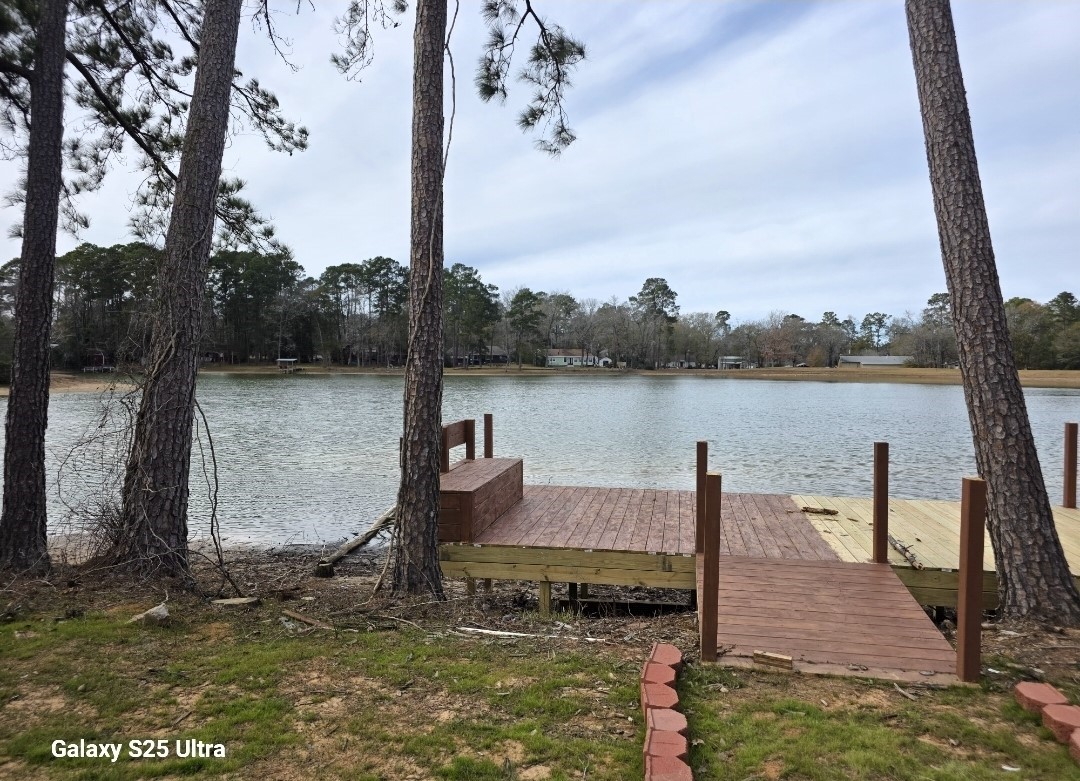 620 St Lawrence River Road Conroe, TX 77316 - Photo 19 of 21 a lake view with a table and chairs