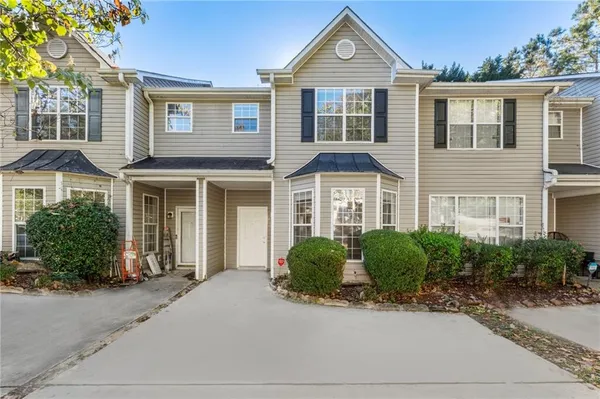 a front view of a house with a yard