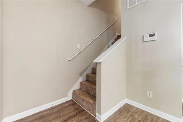 a view of entryway with wooden floor