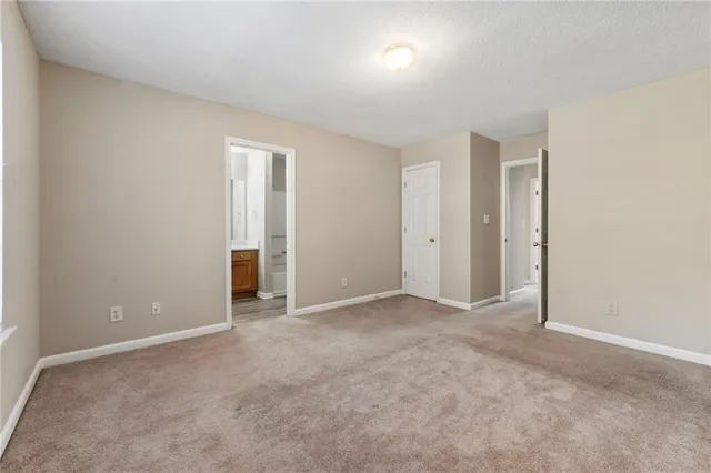an empty room with closet area