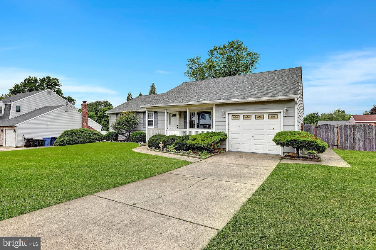 114 Pelham Road Delran, NJ 08075 - Photo 2 of 18 a front view of a house with a yard and garage