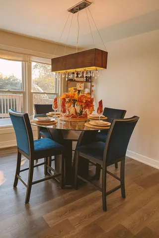 a view of a dining room with furniture and window
