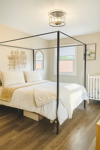 a bedroom with a bed and a table