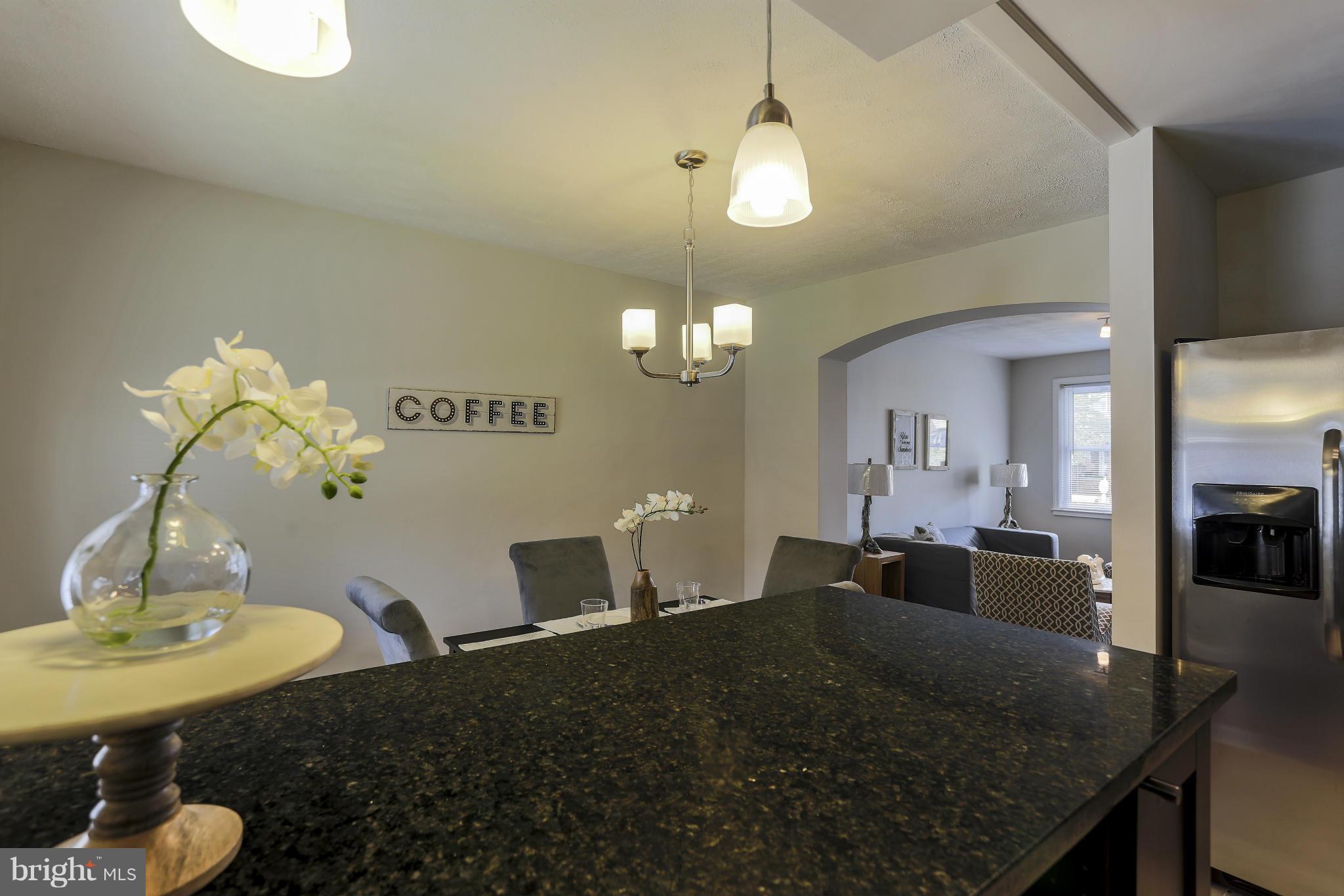 6923 Belclare Road Baltimore, MD 21222 - Photo 11 of 23 a living room with dining table
