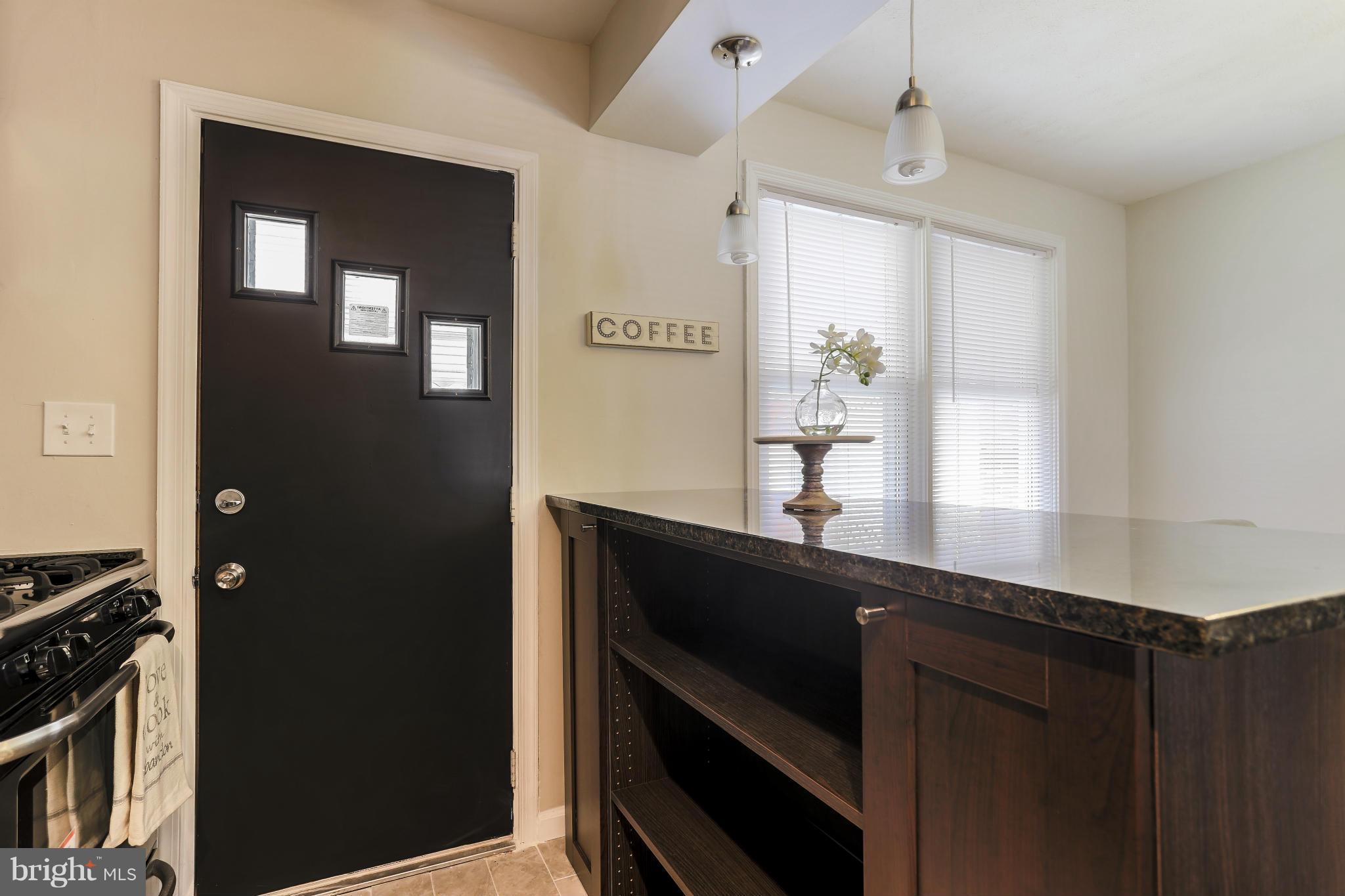 6923 Belclare Road Baltimore, MD 21222 - Photo 13 of 23 a kitchen with a sink and cabinets