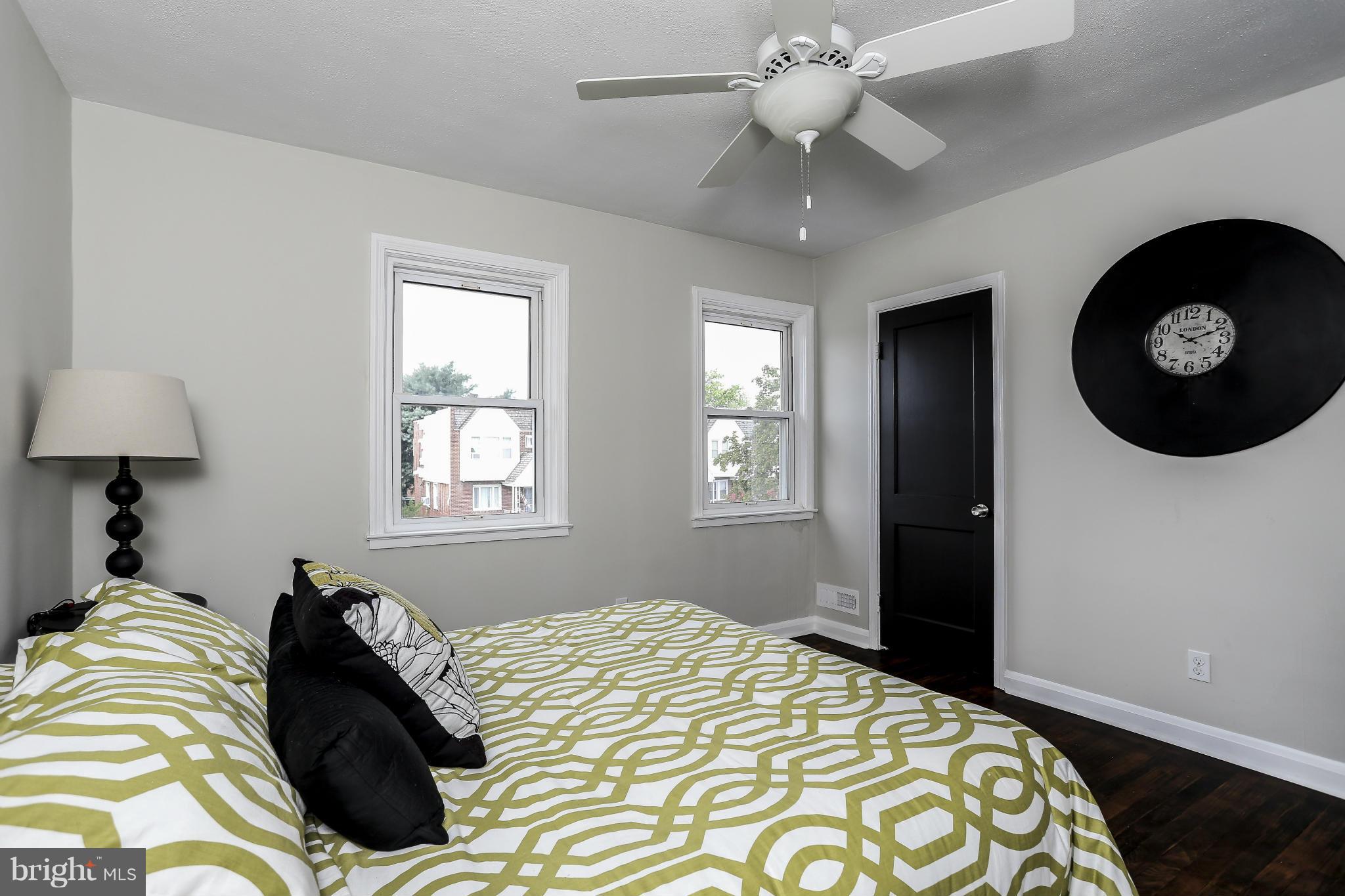 6923 Belclare Road Baltimore, MD 21222 - Photo 18 of 23 a bedroom with a bed and a window