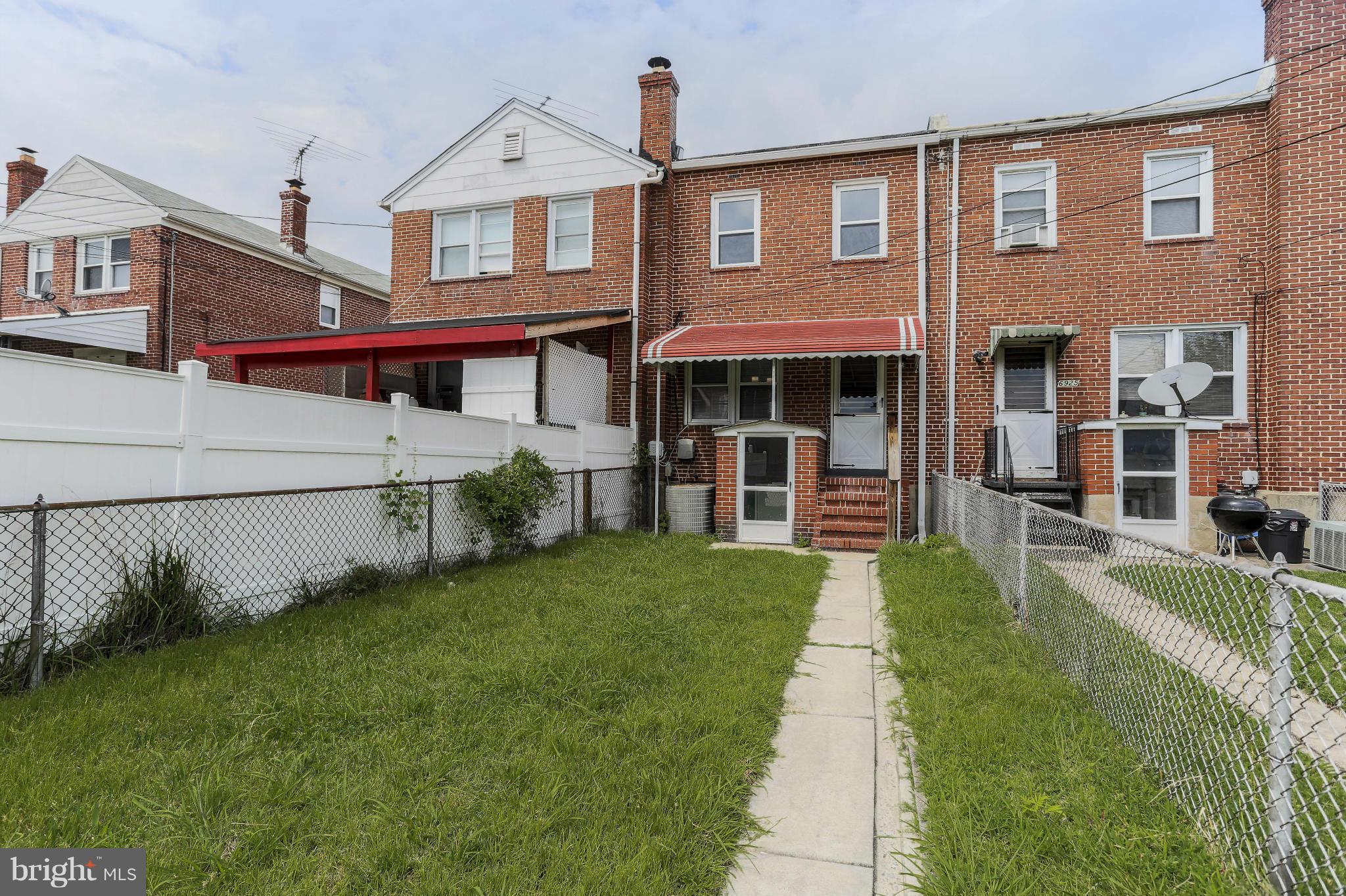 6923 Belclare Road Baltimore, MD 21222 - Photo 22 of 23 a front view of a house with a yard