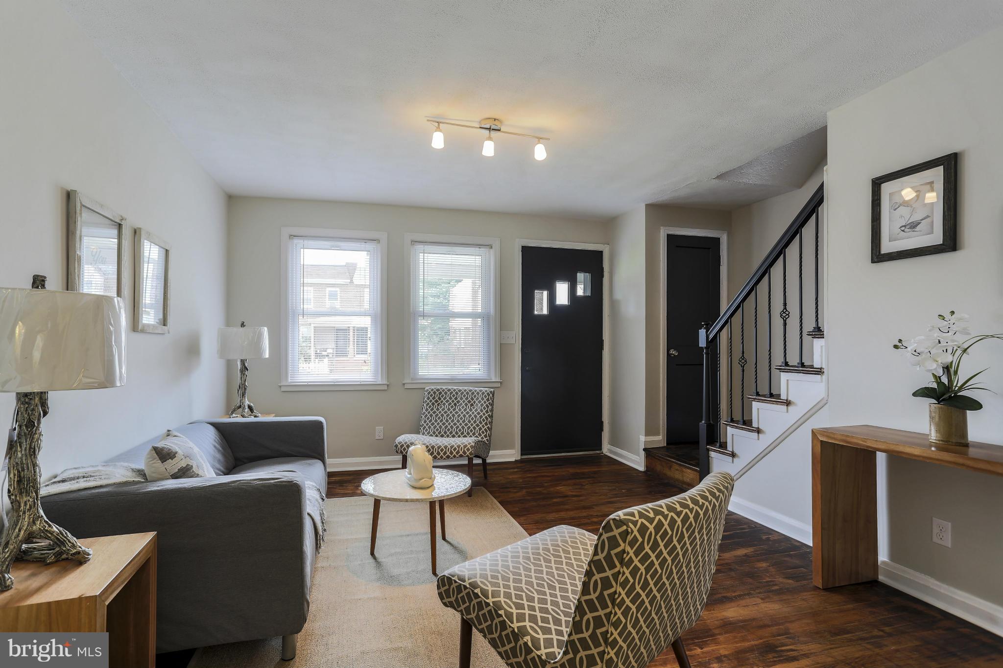 6923 Belclare Road Baltimore, MD 21222 - Photo 5 of 23 a living room with furniture and a window