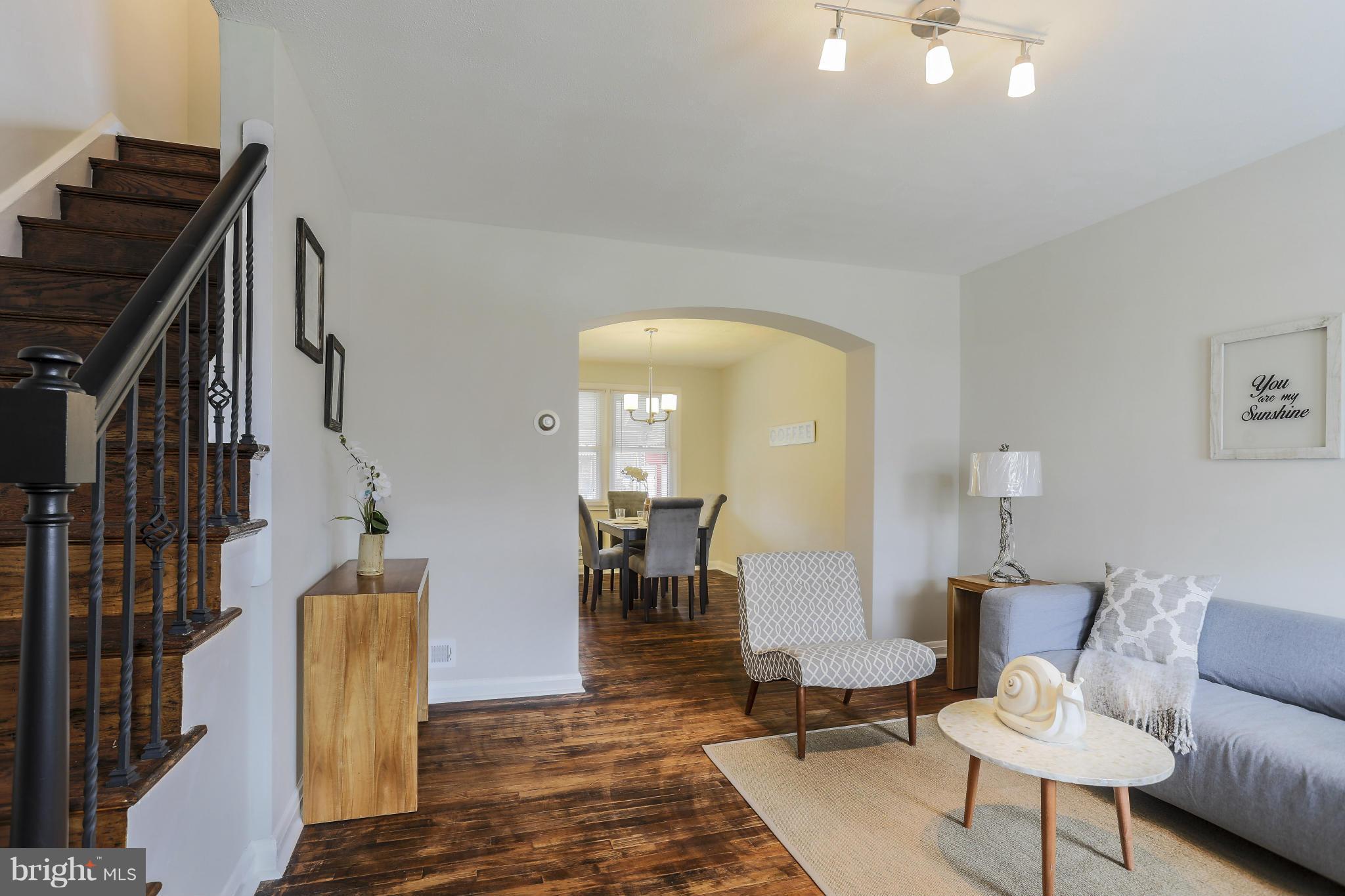 6923 Belclare Road Baltimore, MD 21222 - Photo 7 of 23 a living room with furniture and wooden floor