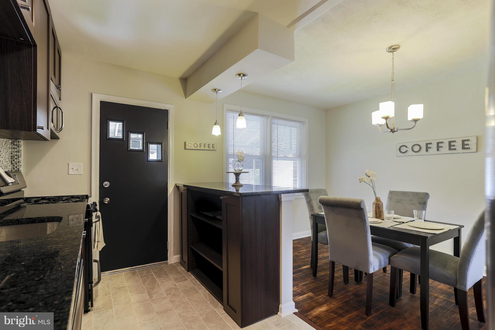 6923 Belclare Road Baltimore, MD 21222 - Photo 8 of 23 a view of a dining room with furniture