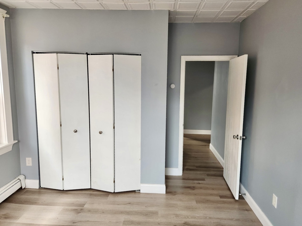 15 North Main Street, Unit 20 Attleboro, MA 02703 - Photo 4 of 6 a view of a hallway with wooden floor