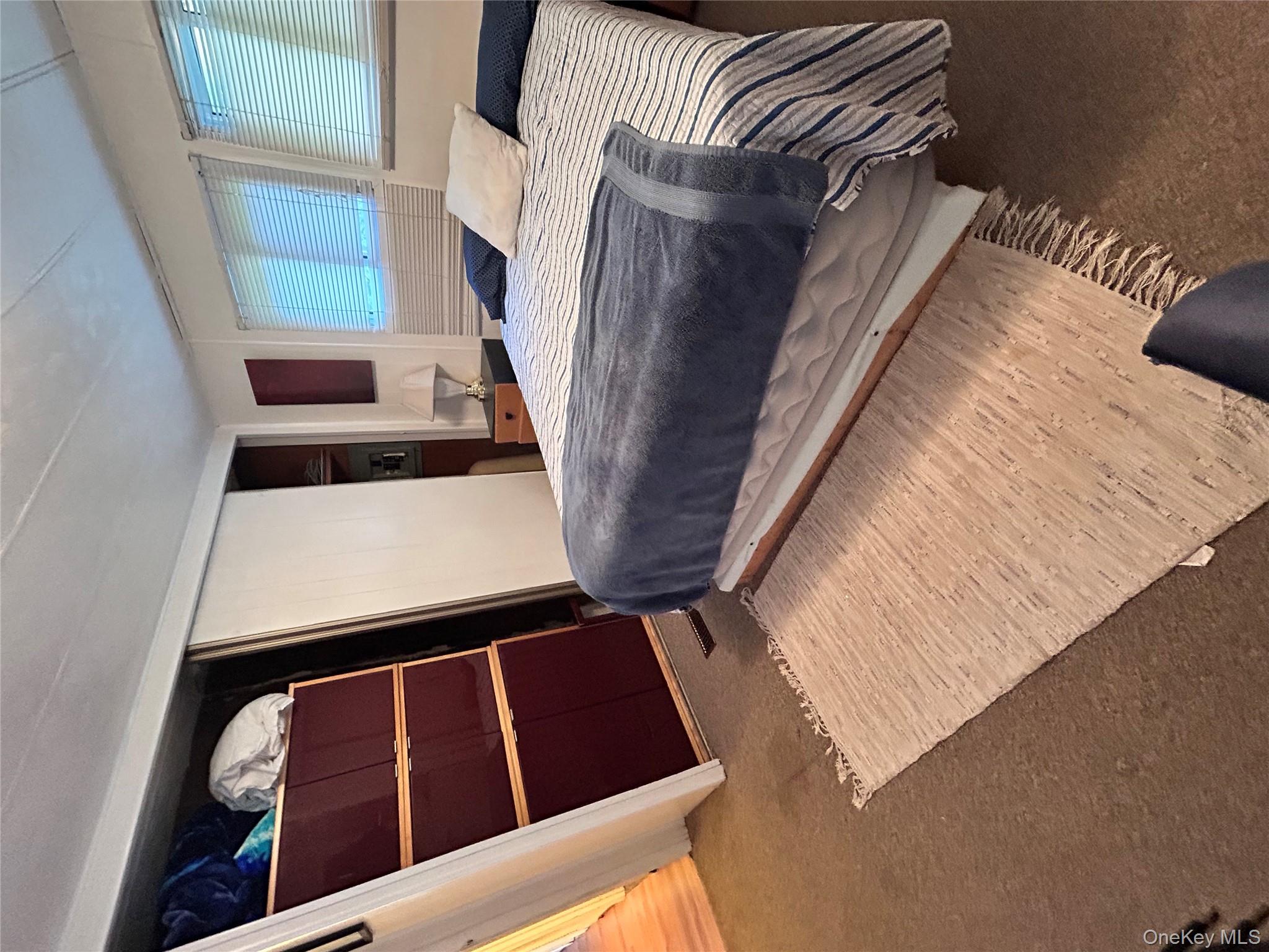 98 Buff Road Cochecton, NY 12726 - Photo 11 of 13 a bedroom with a bed and a window