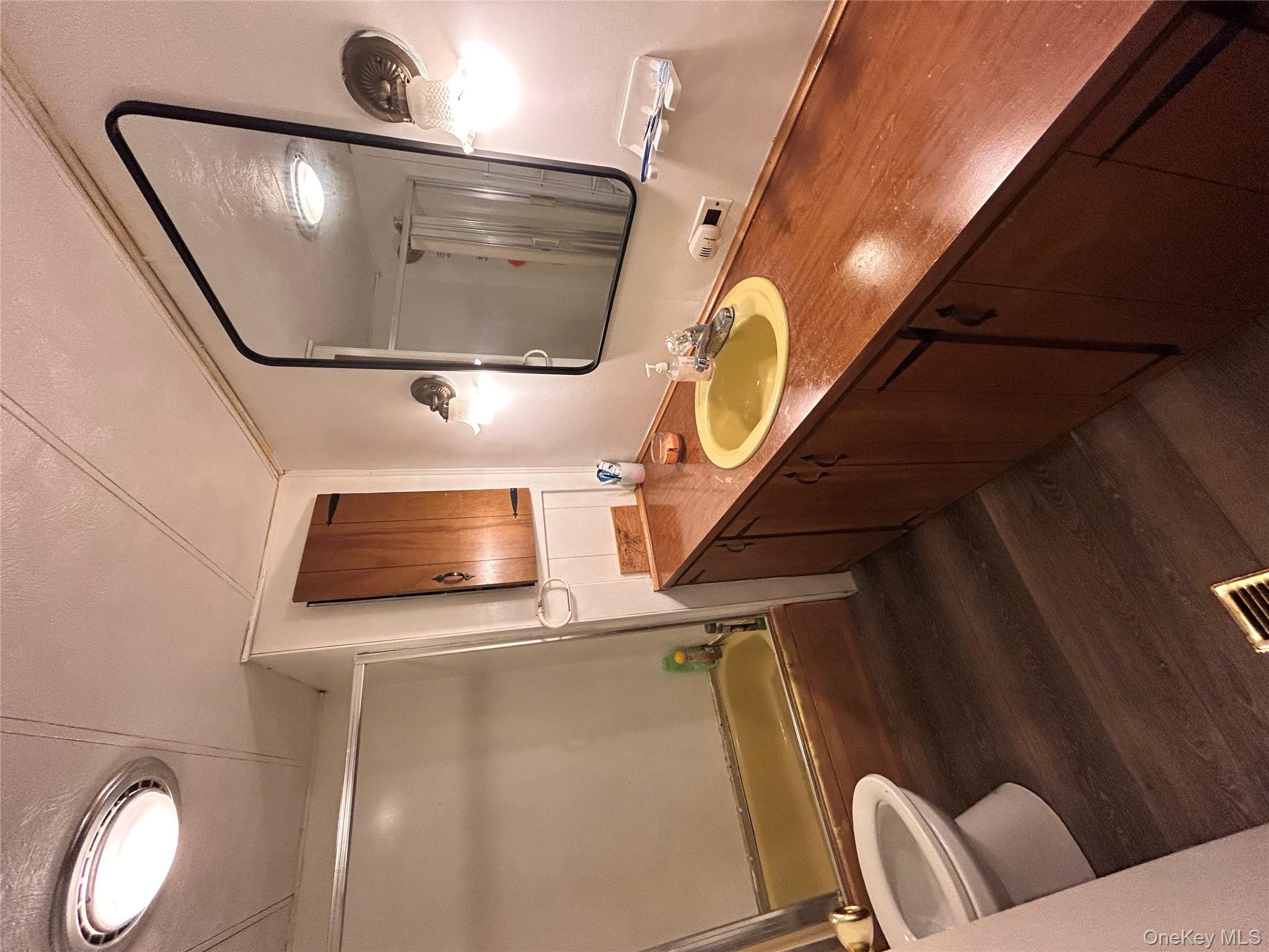 98 Buff Road Cochecton, NY 12726 - Photo 6 of 13 a bathroom with a sink and a mirror