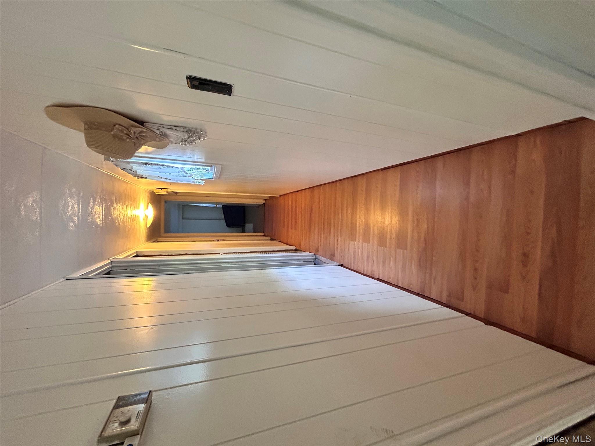 98 Buff Road Cochecton, NY 12726 - Photo 7 of 13 a view of a hallway with wooden floor