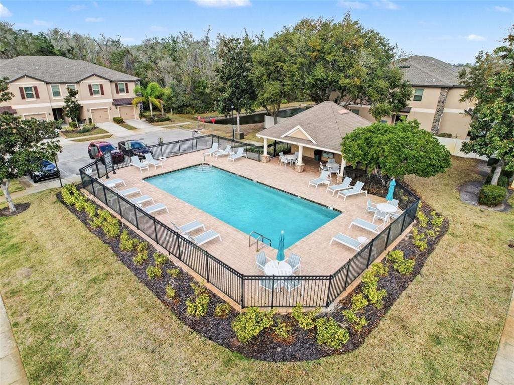 11807 Castine Street New Port Richey, FL 34654 - Photo 28 of 41 a view of a swimming pool with a yard and seating area