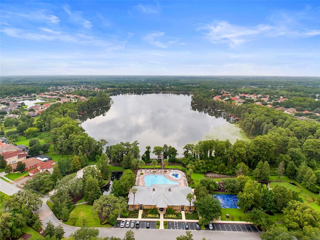 11807 Castine Street New Port Richey, FL 34654 - Photo 30 of 41 an aerial view of a house with a garden and lake view