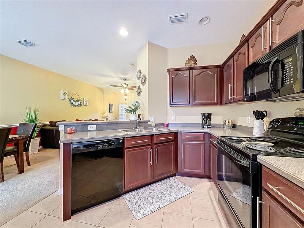 11807 Castine Street New Port Richey, FL 34654 - Photo 6 of 41 a kitchen with stainless steel appliances granite countertop a stove and a sink