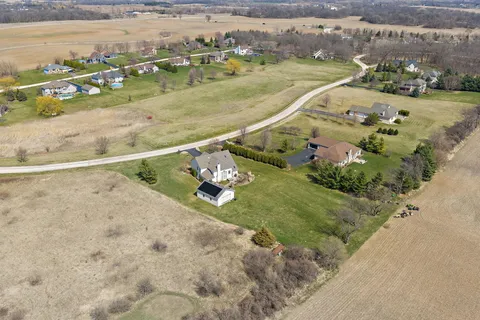 an aerial view of a house with outdoor space