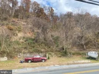 a pink bench sitting in middle of a field