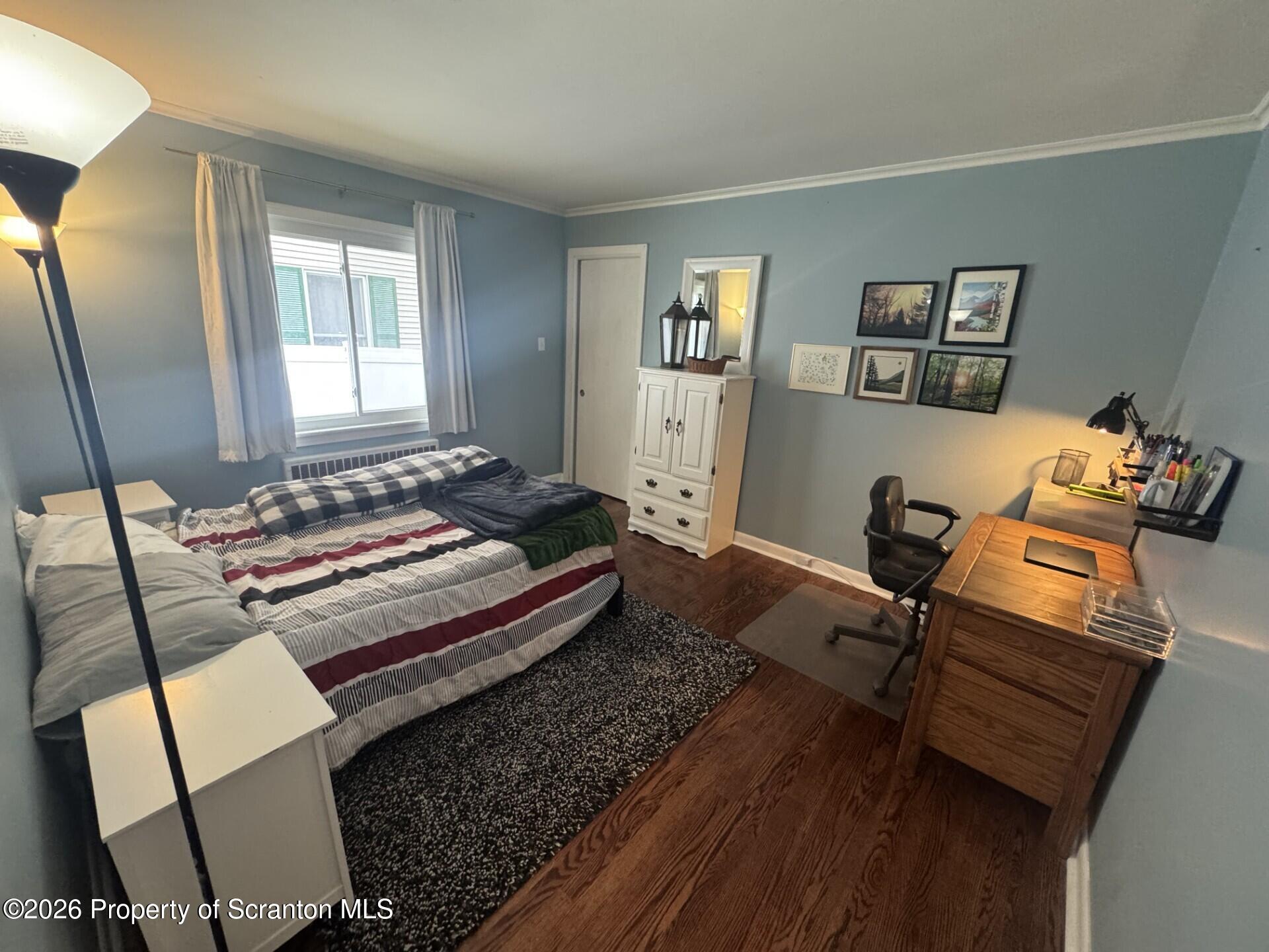 2220 Capouse Avenue Scranton, PA 18509 - Photo 11 of 18 a bedroom with a bed and wooden floor