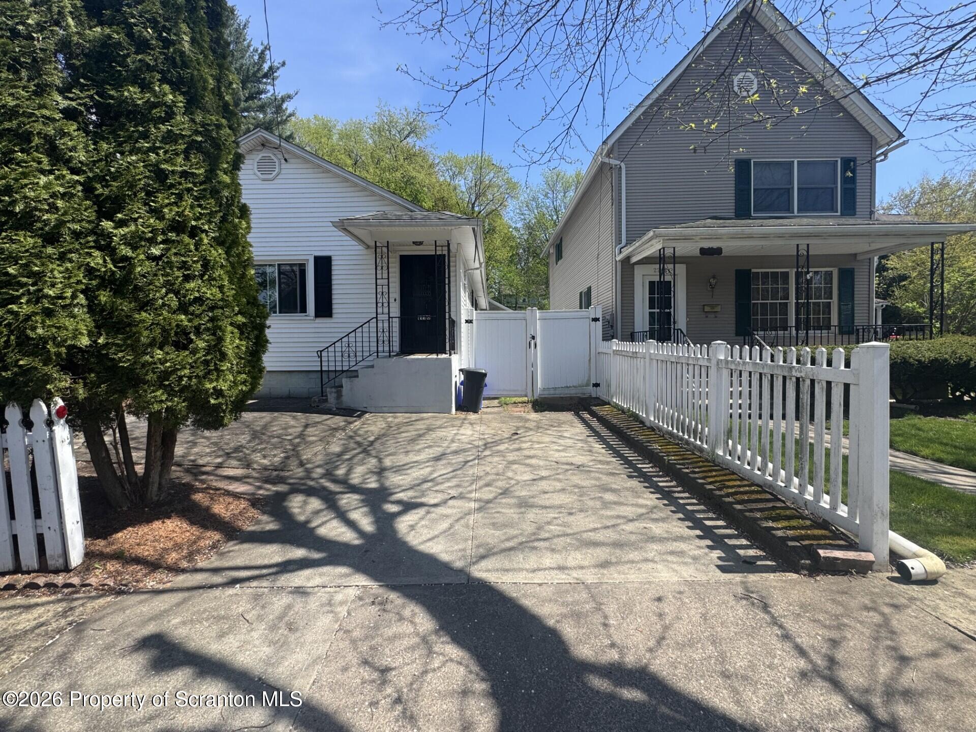 2220 Capouse Avenue Scranton, PA 18509 - Photo 17 of 18 a front view of a house with a yard