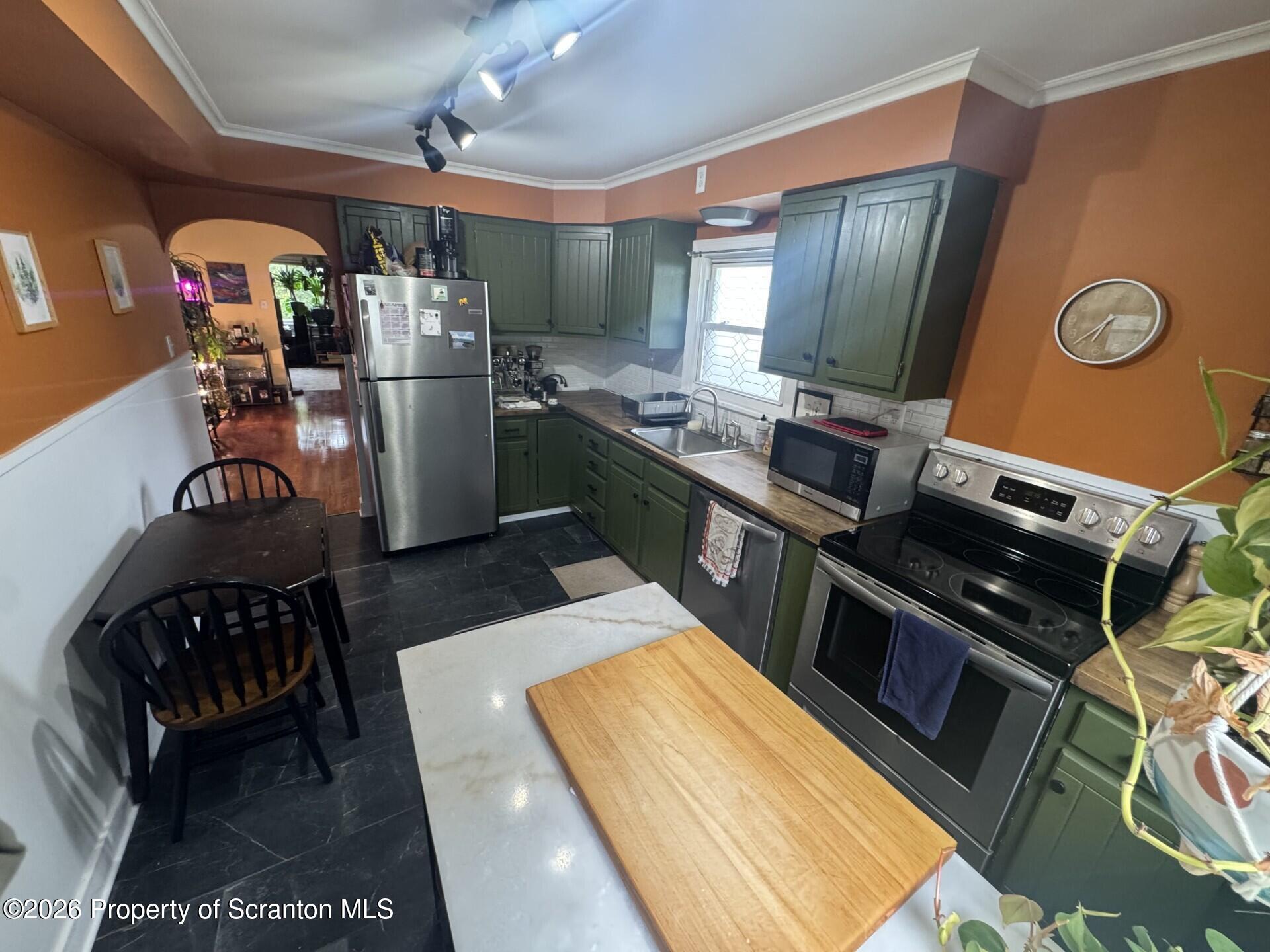 2220 Capouse Avenue Scranton, PA 18509 - Photo 7 of 18 a kitchen with refrigerator and stove