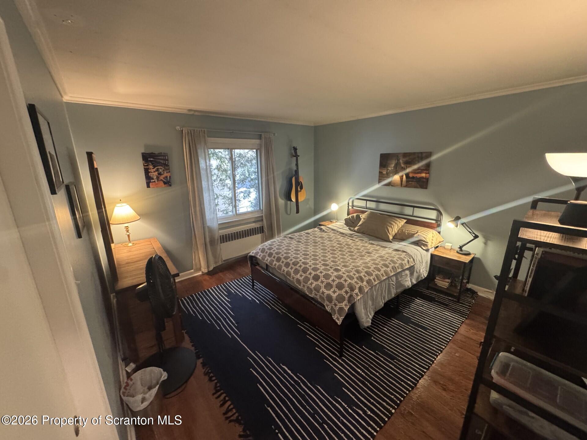 2220 Capouse Avenue Scranton, PA 18509 - Photo 10 of 18 a bedroom with a bed and wooden floor