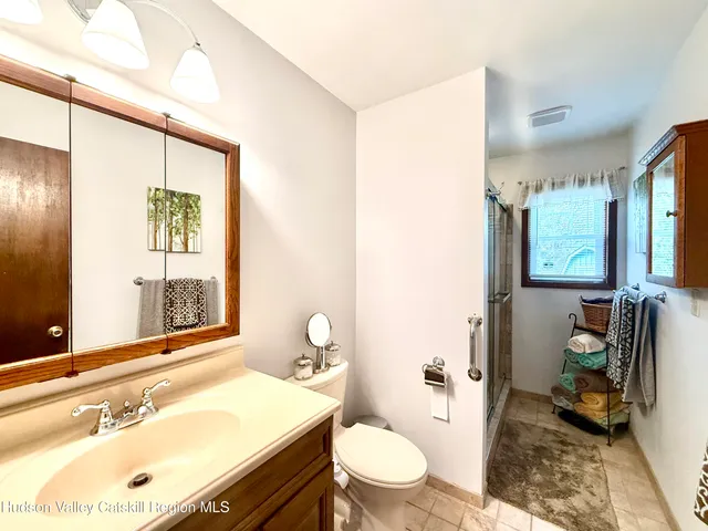a view of a dining room with furniture and a chandelier