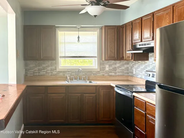 a utility room with a table and chairs