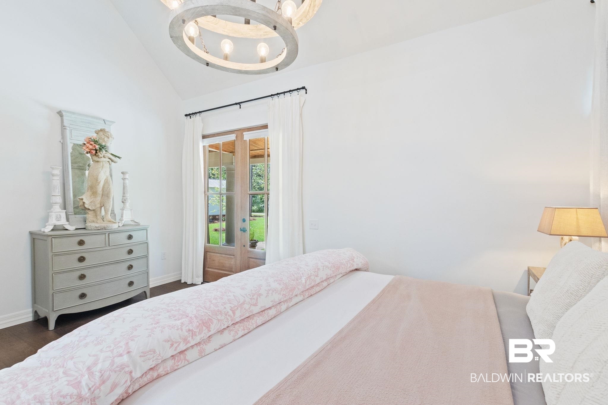 11855 Heather Dells Lane Foley, AL 36535 - Photo 23 of 48 Bedroom with dark hardwood / wood-style floors, high vaulted ceiling, and an inviting chandelier