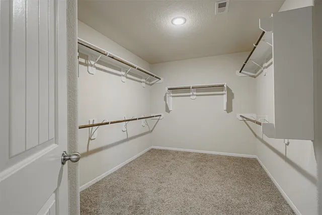 a view of an empty room with windows