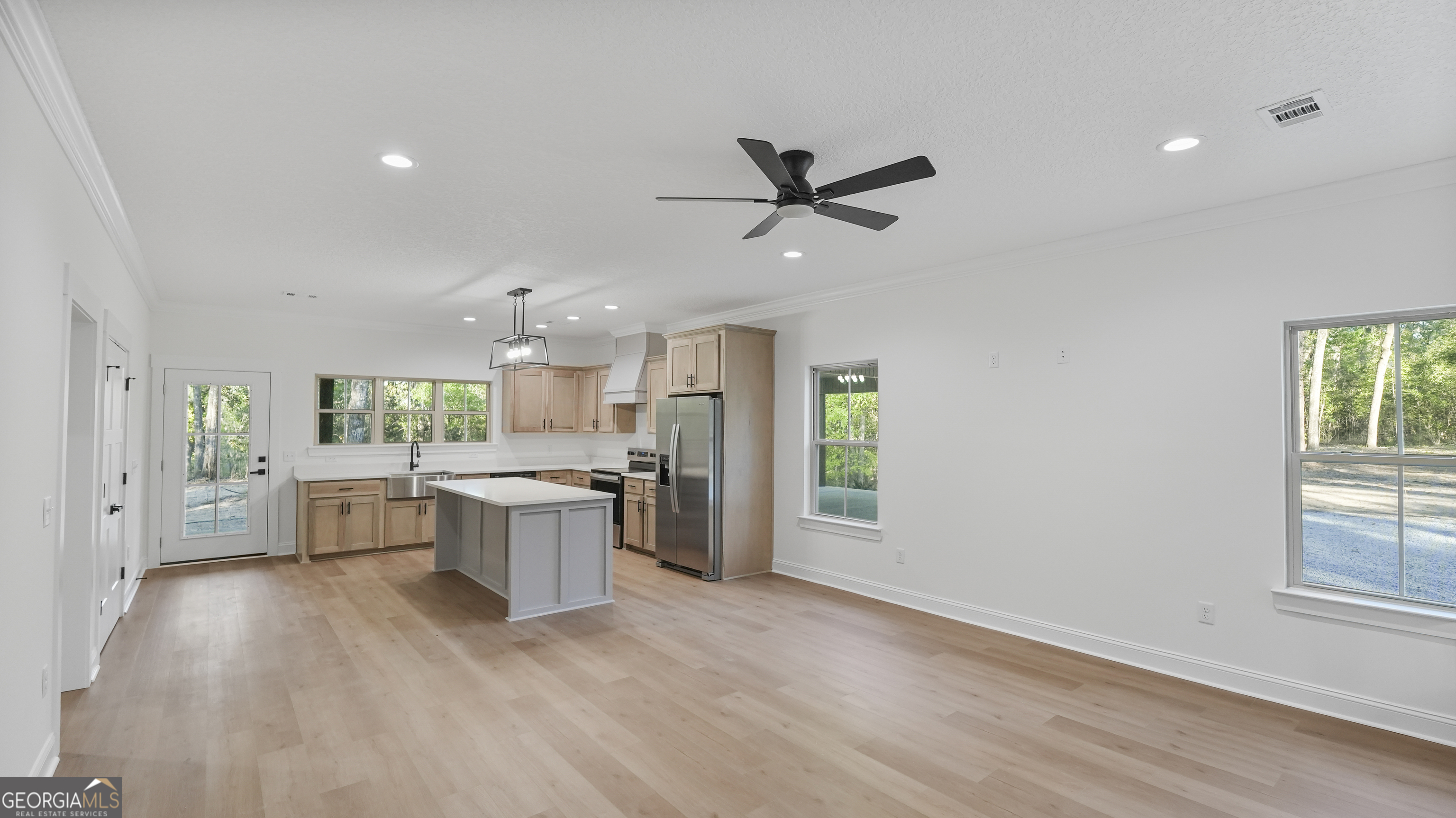 150 Lakeview Drive Jesup, GA 31545 - Photo 17 of 34 a large kitchen with a lot of counter space and a wooden floor