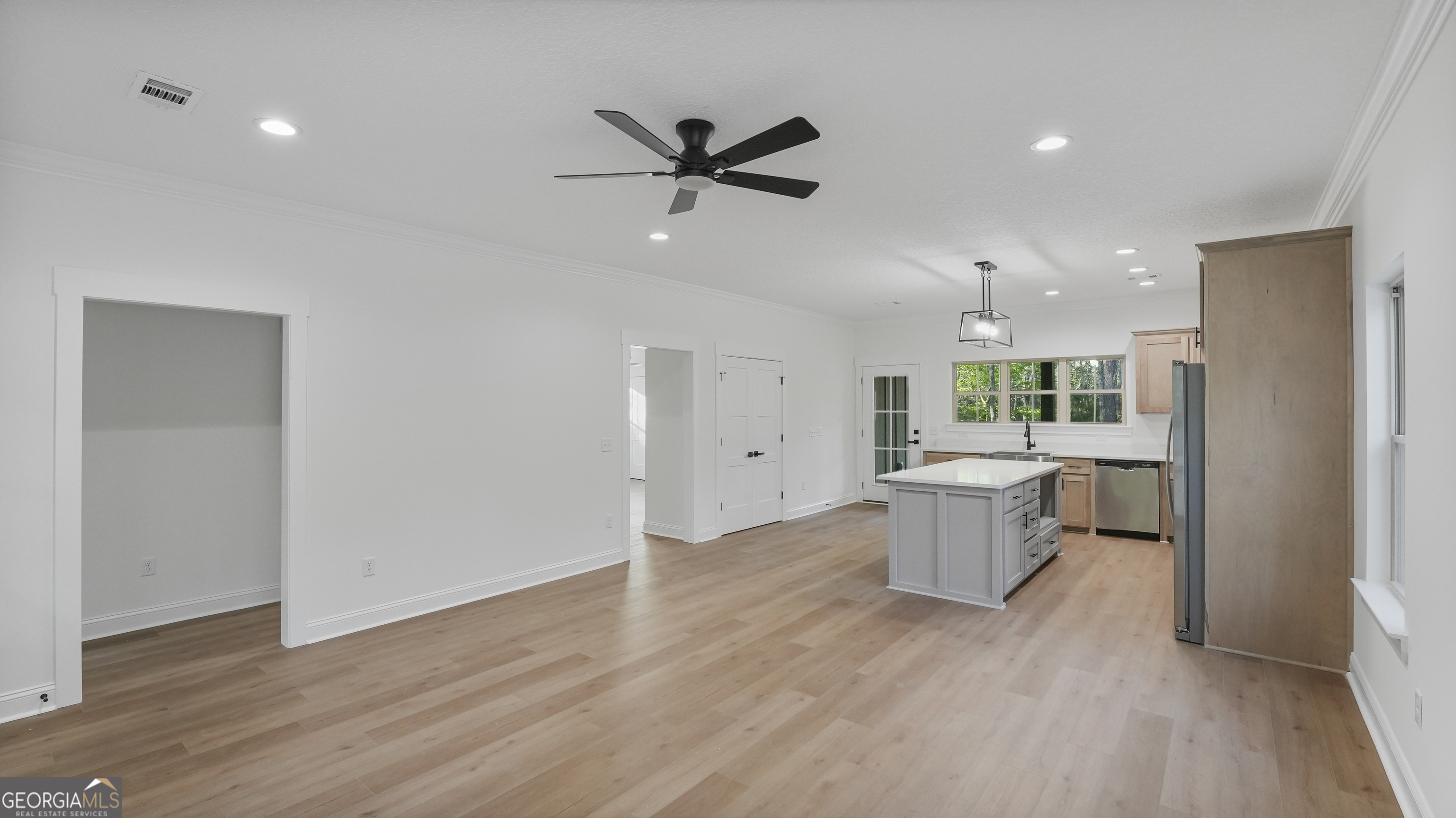 150 Lakeview Drive Jesup, GA 31545 - Photo 18 of 34 a view of a kitchen with a sink and dishwasher a refrigerator with wooden floor